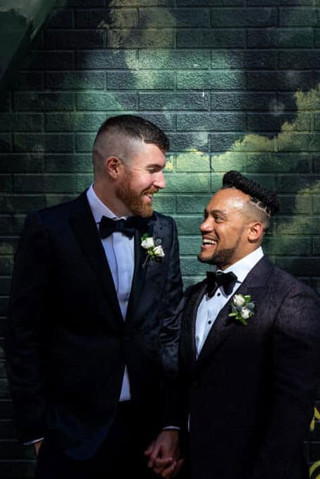 A gay couple poses during their wedding day in Toronto